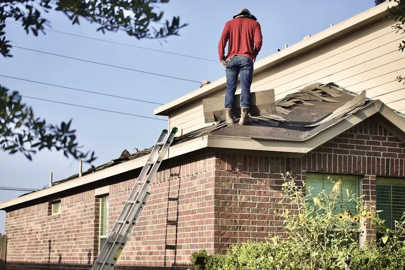 Professional roofer working on a residential roof in Hunt Valley Estates